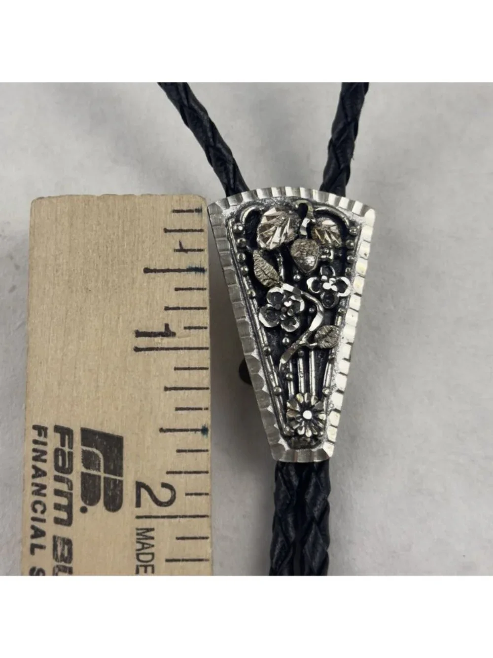 Vtg Black Hills Sterling Silver Bolo Tie Floral Silver Tips Braided Leather USA